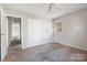 A cozy bedroom featuring neutral walls and carpet at 3030 Crawford Ave, Gastonia, NC 28052