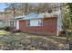 Lovely single-story home with a red brick facade, white trim and ample natural light, nestled in a serene setting at 3030 Crawford Ave, Gastonia, NC 28052