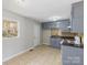 A cozy kitchen featuring blue cabinets and modern appliances at 3030 Crawford Ave, Gastonia, NC 28052