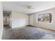 Inviting living room with carpet, natural light, and a ceiling fan, offering a comfortable and airy space at 3030 Crawford Ave, Gastonia, NC 28052