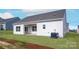 The backyard features green grass, an AC unit, and a covered porch area at 3262 Maple Ridge Dr, Gastonia, NC 28052