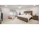 Bright primary bedroom features a large bed, natural light and a ceiling fan at 3878 Fairlady Ln, Fort Mill, SC 29707