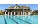 Large community pool with a clubhouse and ample seating, perfect for relaxation and recreation at 3878 Fairlady Ln, Fort Mill, SC 29707