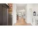 Inviting entryway with hardwood floors, a decorative wreath, and a view into the open-concept living space at 3878 Fairlady Ln, Fort Mill, SC 29707