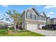 Charming two-story home featuring stone accents, a two-car garage, and a well-manicured front yard at 3878 Fairlady Ln, Fort Mill, SC 29707