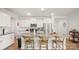 Bright kitchen with white cabinetry, stainless steel appliances, and a large center island with seating at 3878 Fairlady Ln, Fort Mill, SC 29707