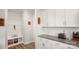 Convenient mud room with built-in bench and coat rack, adjacent to the kitchen at 3878 Fairlady Ln, Fort Mill, SC 29707