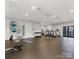 Spacious workout room with modern equipment, including treadmills and free weights for a complete fitness experience at 3878 Fairlady Ln, Fort Mill, SC 29707