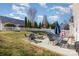 This backyard has patio seating, a playset and a white picket fence at 4214 High Shoals Dr, Monroe, NC 28110