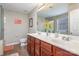 Bright bathroom featuring a double sink vanity, a large mirror, and a glass-enclosed shower at 4214 High Shoals Dr, Monroe, NC 28110