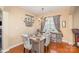 Bright dining room with hardwood floors, chandelier, and large windows allowing plenty of natural light at 4214 High Shoals Dr, Monroe, NC 28110