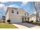 Inviting home with siding, a two-car garage, and a beautifully maintained front yard at 4214 High Shoals Dr, Monroe, NC 28110