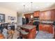 Gourmet kitchen featuring custom cabinetry, granite countertops, a center island, and state-of-the-art appliances at 4214 High Shoals Dr, Monroe, NC 28110