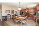 Kitchen with stainless steel appliances, dark wood cabinets, and an adjacent dining area at 4214 High Shoals Dr, Monroe, NC 28110