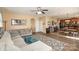 Spacious living room featuring hardwood floors, ceiling fan, and an open floor plan at 4214 High Shoals Dr, Monroe, NC 28110