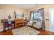 Cozy living room features hardwood floors, a bright window, and comfortable seating at 4214 High Shoals Dr, Monroe, NC 28110