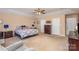 Spacious primary bedroom with a king bed, sitting area, and neutral decor at 4214 High Shoals Dr, Monroe, NC 28110