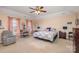 Spacious bedroom with large windows, comfortable seating, and a vanity area at 4214 High Shoals Dr, Monroe, NC 28110