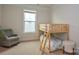 Bright bedroom featuring a wooden bunk bed, plush carpeting, and natural light from a window at 4246 Millstream Rd, Denver, NC 28037