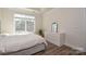 Bright bedroom featuring a large window, ample natural light, and neutral decor at 4246 Millstream Rd, Denver, NC 28037