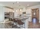 Modern kitchen featuring a large island, stainless steel appliances, and white cabinets at 4246 Millstream Rd, Denver, NC 28037