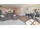 Open-concept living room featuring modern finishes, hardwood floors, and seamless kitchen access at 4246 Millstream Rd, Denver, NC 28037