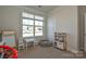 Bright and spacious playroom with large window, toys, and ample space for activities at 4246 Millstream Rd, Denver, NC 28037
