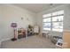Bright and spacious playroom with large window, toys, and ample space for activities at 4246 Millstream Rd, Denver, NC 28037