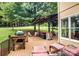 Backyard deck boasting ample seating, grill, and a covered area for outdoor entertaining at 4825 1St Street Nw Ct, Hickory, NC 28601
