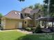 Spacious backyard featuring a deck, gazebo, and lush green lawn, perfect for outdoor living and entertaining at 4825 1St Street Nw Ct, Hickory, NC 28601