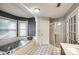 Spacious bathroom boasts a soaking tub, separate shower and lots of natural light at 4825 1St Street Nw Ct, Hickory, NC 28601