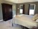 Comfortable bedroom with soft carpet, closet, and sunny windows, making it a relaxing retreat at 4825 1St Street Nw Ct, Hickory, NC 28601
