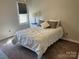 This bedroom has a queen sized bed and large window letting in plenty of light at 4825 1St Street Nw Ct, Hickory, NC 28601