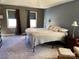 Comfortable bedroom features neutral tones, ample natural light, and relaxing ambiance at 4825 1St Street Nw Ct, Hickory, NC 28601
