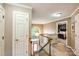 Bright hallway with staircase, large arched window, and access to bedrooms at 4825 1St Street Nw Ct, Hickory, NC 28601