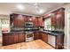 Beautiful kitchen with granite countertops, stainless steel appliances, and custom wood cabinetry at 4825 1St Street Nw Ct, Hickory, NC 28601