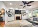 Cozy living room with fireplace, built-in shelving, and large windows with natural light at 4825 1St Street Nw Ct, Hickory, NC 28601