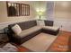 Comfortable living room featuring a plush sectional sofa and decorative wall mirrors at 4825 1St Street Nw Ct, Hickory, NC 28601