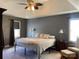 Spacious main bedroom features tray ceilings, ample natural light, and comfortable furnishings at 4825 1St Street Nw Ct, Hickory, NC 28601