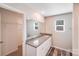 Bathroom features large mirror, granite countertop and ample cabinet space at 509 Holly St, Statesville, NC 28677