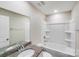 Modern bathroom featuring a granite vanity, shower-tub combination and a large mirror at 509 Holly St, Statesville, NC 28677