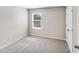 Comfortable bedroom offers neutral carpet, paint and window with blinds at 509 Holly St, Statesville, NC 28677