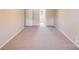 Spacious carpeted bedroom with neutral walls and ample natural light from the window at 509 Holly St, Statesville, NC 28677