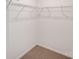 A simple closet with a carpet floor and metal shelving at 509 Holly St, Statesville, NC 28677