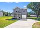 Charming two-story home with a well-maintained lawn, a garage and a front porch at 509 Holly St, Statesville, NC 28677