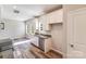 Bright kitchen features modern appliances, white cabinets, and wood flooring at 509 Holly St, Statesville, NC 28677