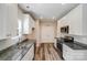 Well-lit kitchen with granite countertops, stainless steel appliances, and hardwood flooring at 509 Holly St, Statesville, NC 28677