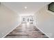 Bright living room with hardwood floors and view of the kitchen and backyard at 509 Holly St, Statesville, NC 28677