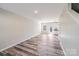Well-lit living room with hardwood floors, neutral walls and backyard view at 509 Holly St, Statesville, NC 28677