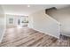 Open-concept living area with hardwood floors and an adjacent kitchen, perfect for entertaining at 509 Holly St, Statesville, NC 28677